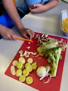 Children preparing vegetables